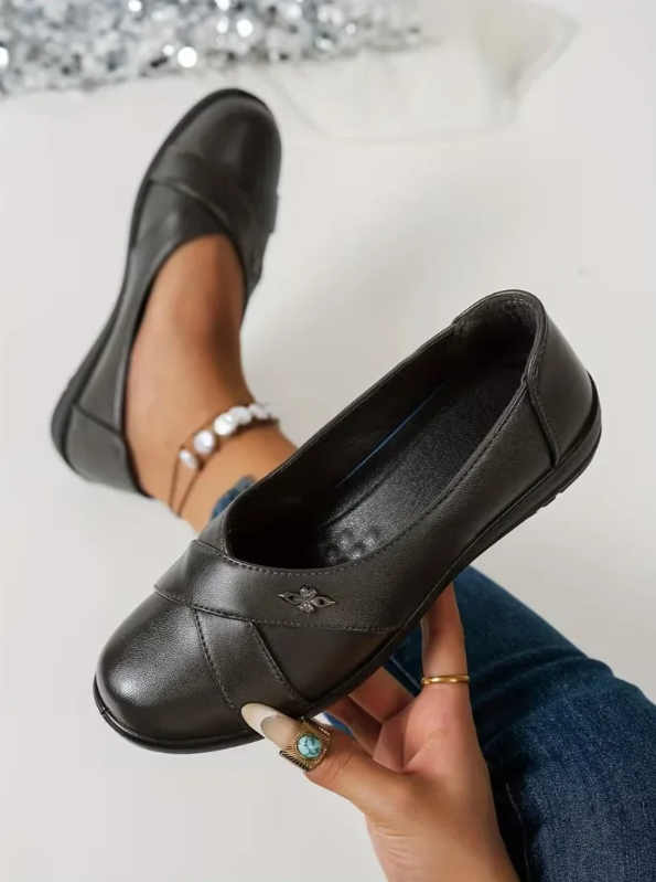 Women’s Leather-Look Slip On Shoes With Metal Emblem