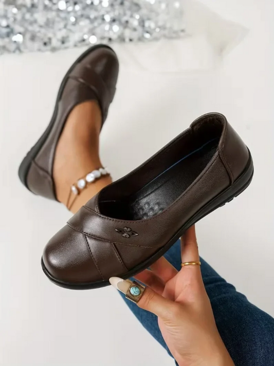 Women’s Leather-Look Slip On Shoes With Metal Emblem
