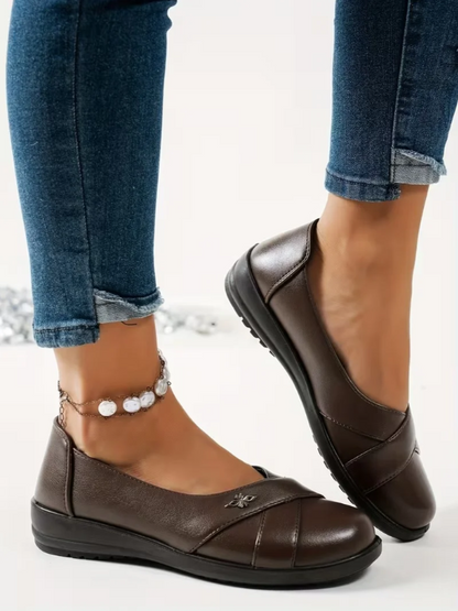Women’s Leather-Look Slip On Shoes With Metal Emblem