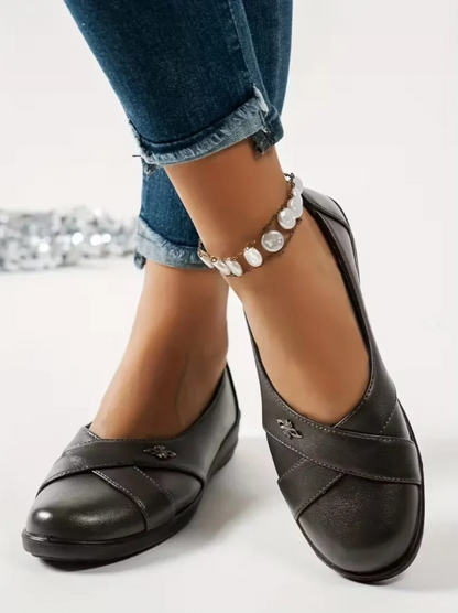 Women’s Leather-Look Slip On Shoes With Metal Emblem