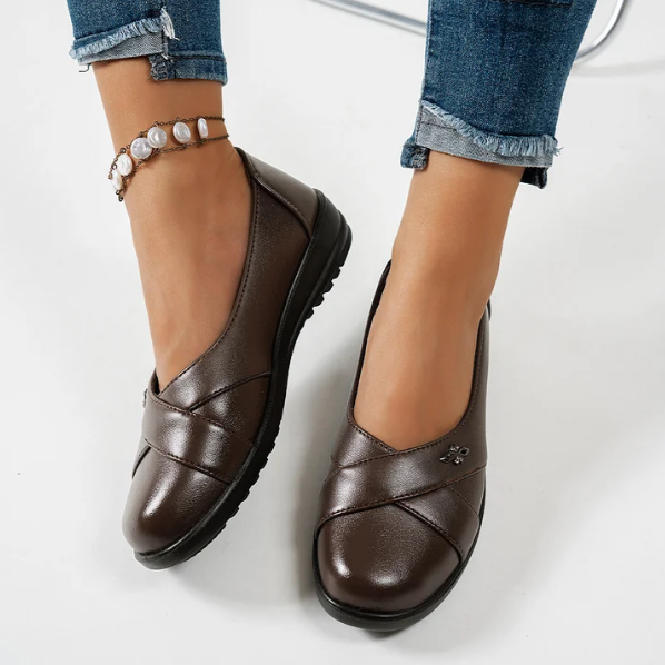 Women’s Leather-Look Slip On Shoes With Metal Emblem
